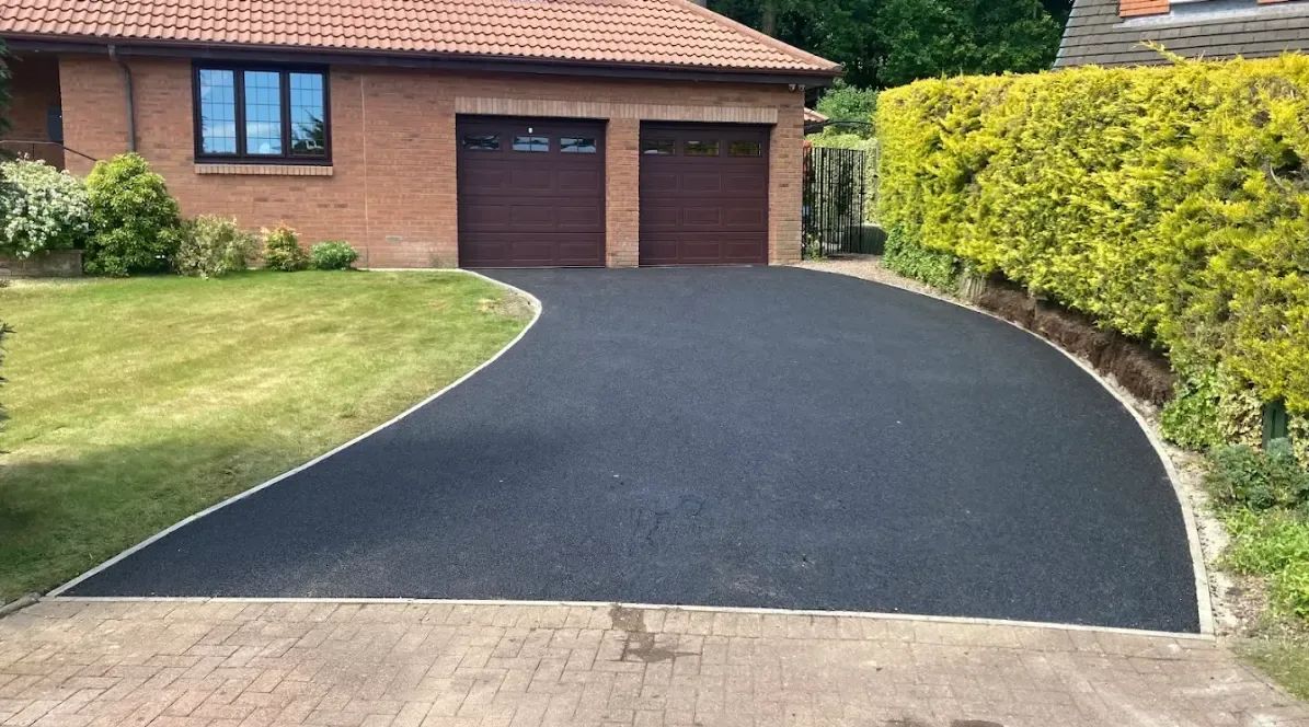 Tarmac driveway with a block paved edging course